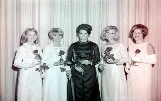 The 1969 Tower Queen and her royal court pose for a group picture prior to the start of the Homecoming Parade.