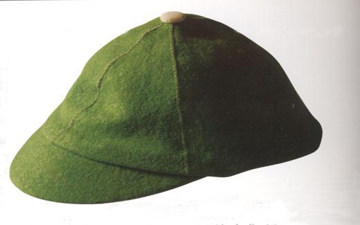 The green beanie was worn by freshman students during the 1950s to indicate their "new" status.  Walk-Out Day signaled the end of having to wear the beanies.