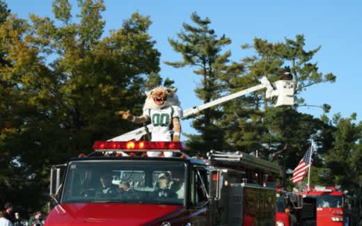 Bobby rides on a fire truck during the 2007 Northwest Homecoming Parade.  Jake Phillips was Bobby from 2003 to 2006 and Bryan Williams was Bobby in the parades from 2008 to 2009.